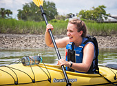 A kayaker enjoys a guided tour with Coastal Expeditions on Shem Creek.