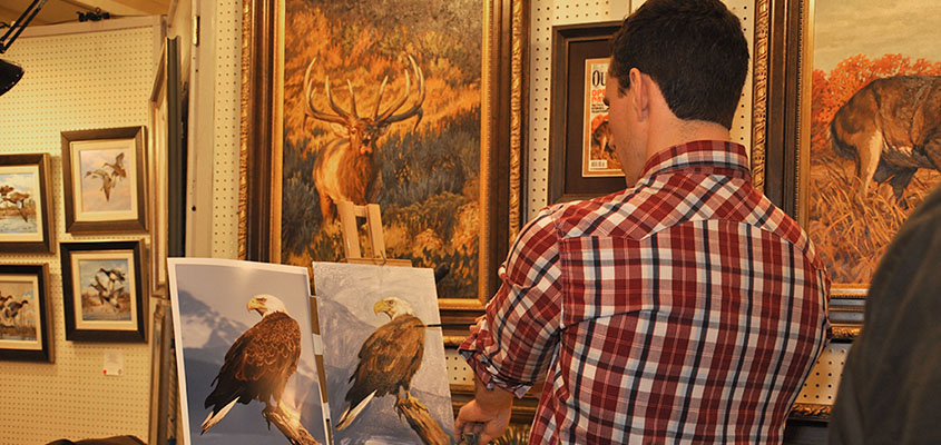 SEWE Painter, Ryan Kirby, takes a step back to check his source in the Quick Draw Event. © 2015 Audra L. Gibson