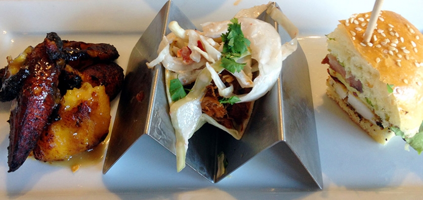Fried plantains, braised pork taco, and jerk chicken at Fuel Cantina.
