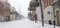 A blanket of snow covers Broad Street as the white steeple of St. Michael's is camouflaged by snowflakes.